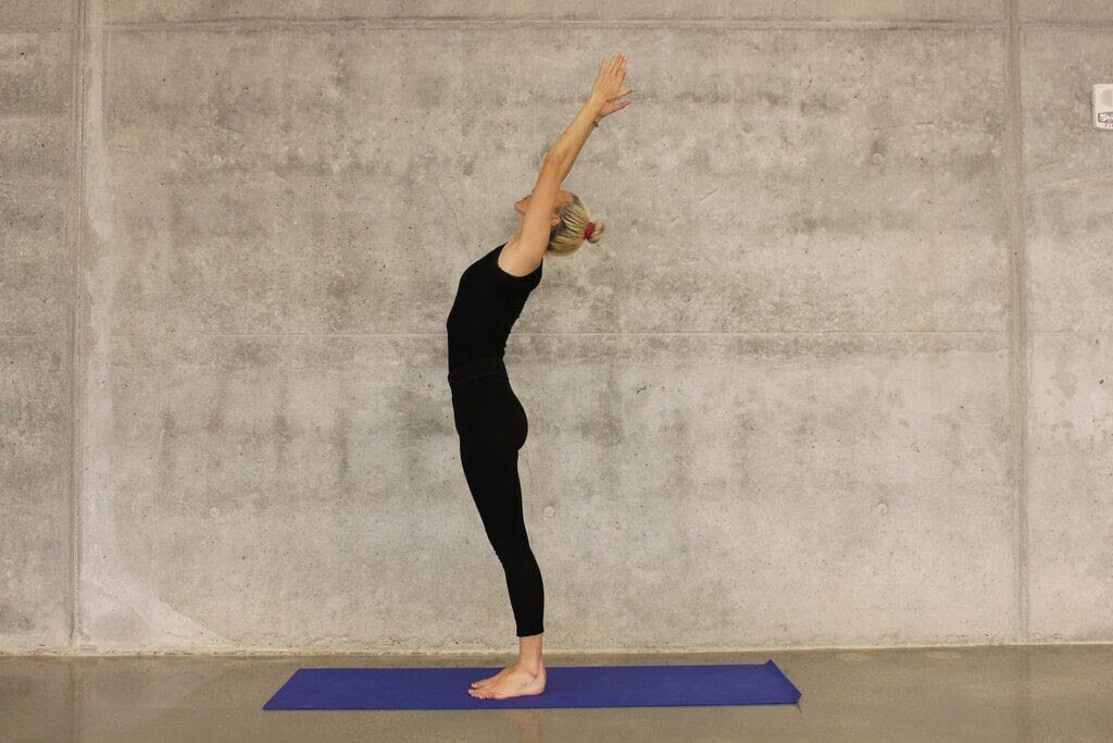 Image of woman practicing Tadasana after doing the best Yoga course in Rewari