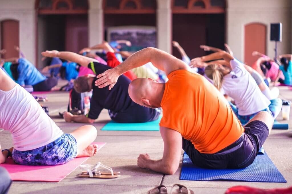 Image of people practicing Yoga after finding the best Yoga course in Charkhi Dadri